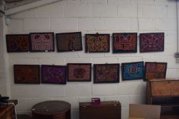 Twelve embroidered wool work pictures mainly geometric designs