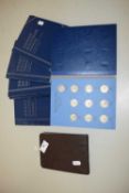 Small photograph album and a boxed collection of coins