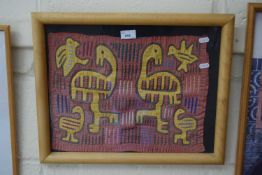 Framed piece of fabric with animal designs