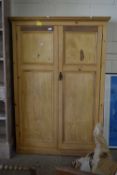 An aged pine tall cupboard, width approx 112cm