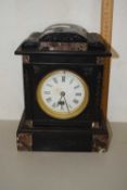 A Victorian black slate mantel clock with white enamel dial and black Roman numerals