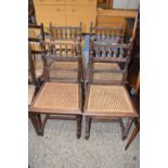 A set of four cane seated 19th Century dining chairs
