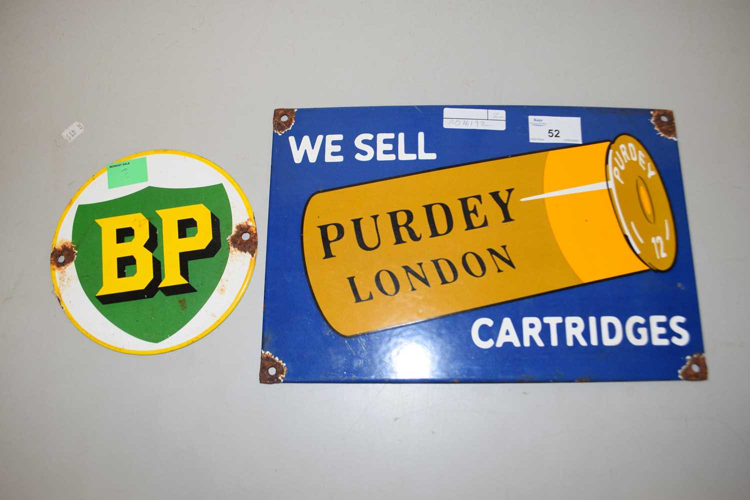 An enamel sign for Purdy Cartridges together with a circular BP sign