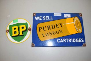 An enamel sign for Purdy Cartridges together with a circular BP sign