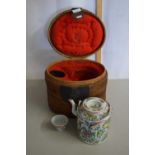 A Cantonese porcelain teapot and tea bowl in original case