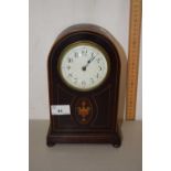 An Edwardian mantel clock with vase inlay