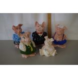 A group of five Wade pig money boxes including a baby pig