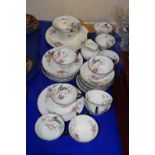 An English porcelain part tea set with a printed floral and bird design comprising cups, saucers,