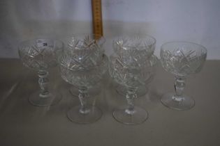 A group of six cut glass dessert glasses