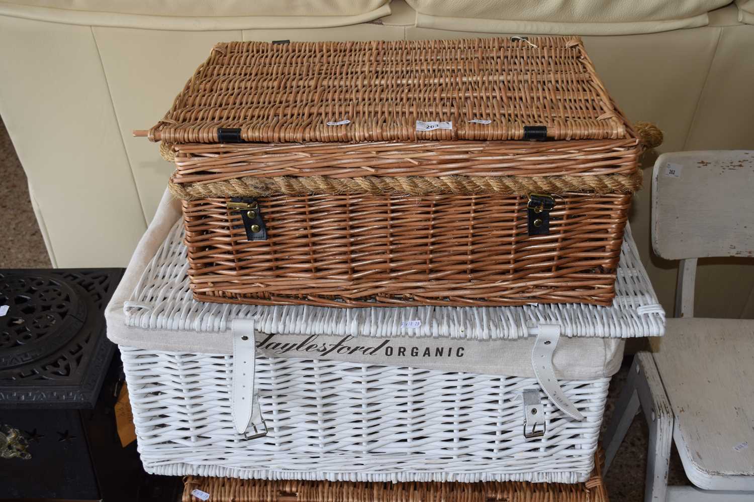 A Daylesford organic hamper basket together with one other