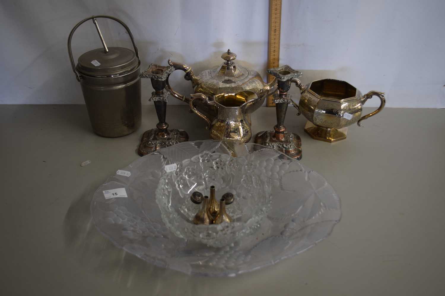 A quantity of glass wares including cut glass bowl, pair of plated candlesticks, ice bucket etc