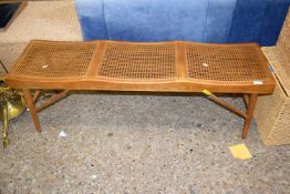 A cane seated jointed three seat bench, length approx 140cm