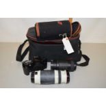 A camera case including a Canon EOS500 camera with Sigma lens and other accessories