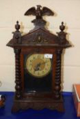 A large mantel clock, late 19th Century with barley twist columns and eagle finial