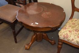Reproduction circular coffee table with claw feet