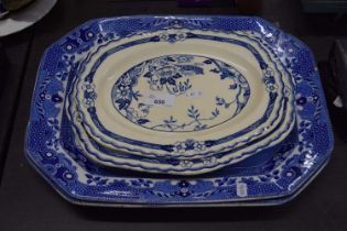Various blue and white plates including two large meat plates