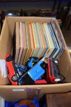 Box containing a quantity of various annuals, toy cars etc