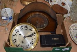 Box containing two clocks and a folding camera
