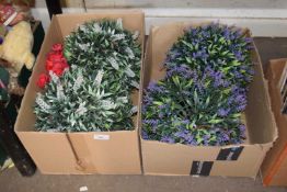 Two boxes of artificial flowers