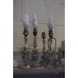 Four various brass table lamps