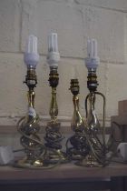 Four various brass table lamps