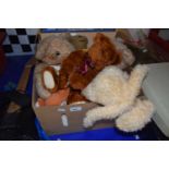 Box containing various soft toys