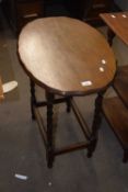 An occasional table with turned legs