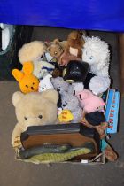 Box containing various soft and other toys