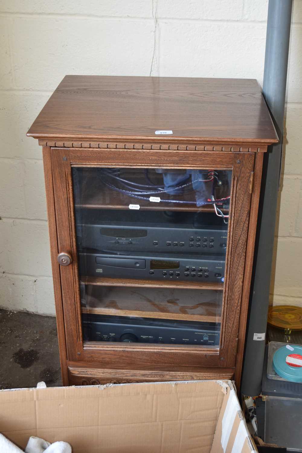 An Ercol glazed hi-fi cabinet containing an Arcam separates system, amplifier, CD, tuner