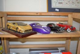 Four various large scale die cast model cars