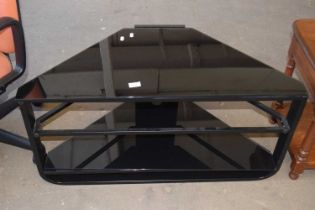 A smoked glass television stand