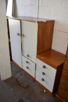 A 1960's style melomine cupboard together with a three drawer bedside cabinet