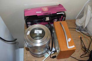 A boxed iron together with a Pure digital radio and a glass kettle