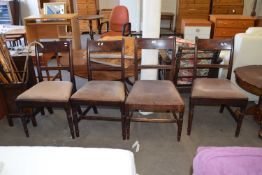 Set of four upholstered dining chairs