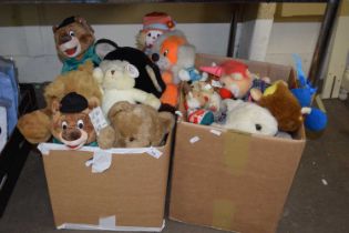 Two boxes of various soft toys