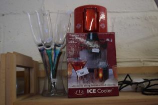 Boxed ice cooler together with champagne flutes etc