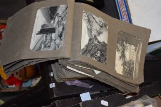 Two albums containing various picture postcards, most appear black and white topographicall with