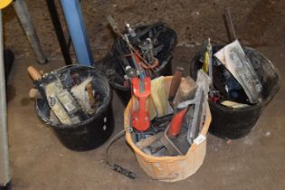 Four buckets of various tools
