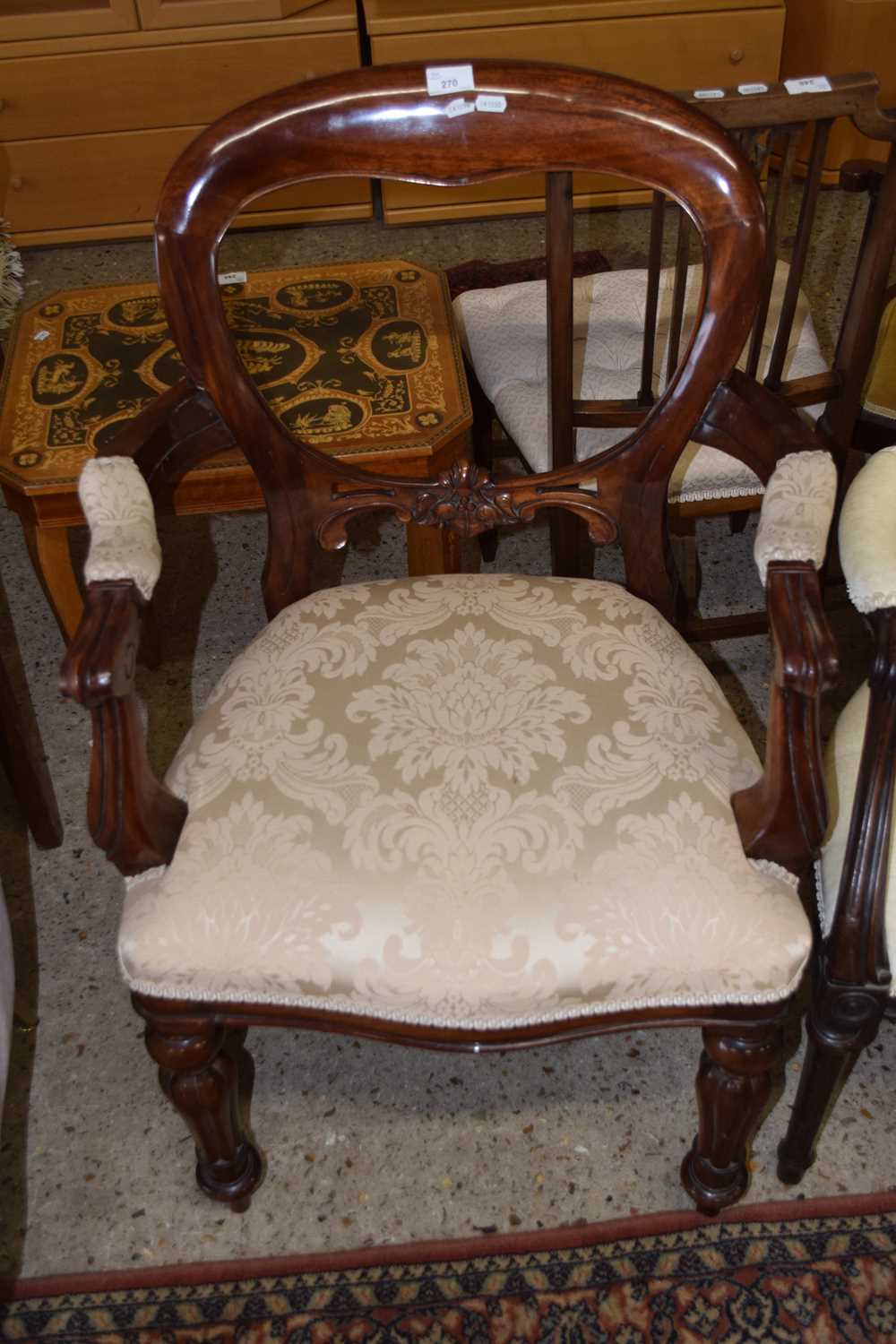 A Victorian carver chair with balloon back and fluted legs