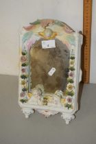 A porcelain framed easel backed dressing table mirror