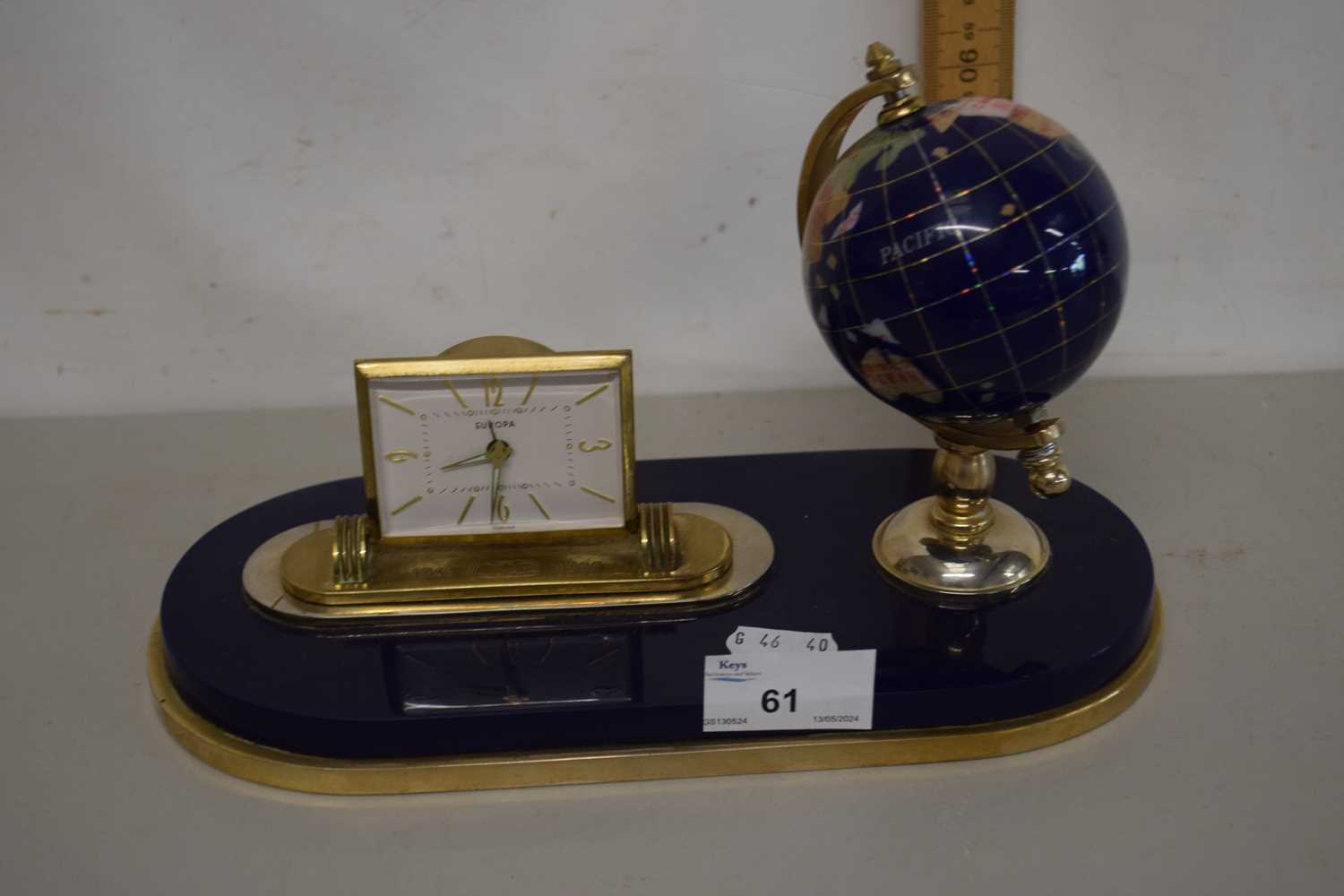 A modern desk clock with globe mount