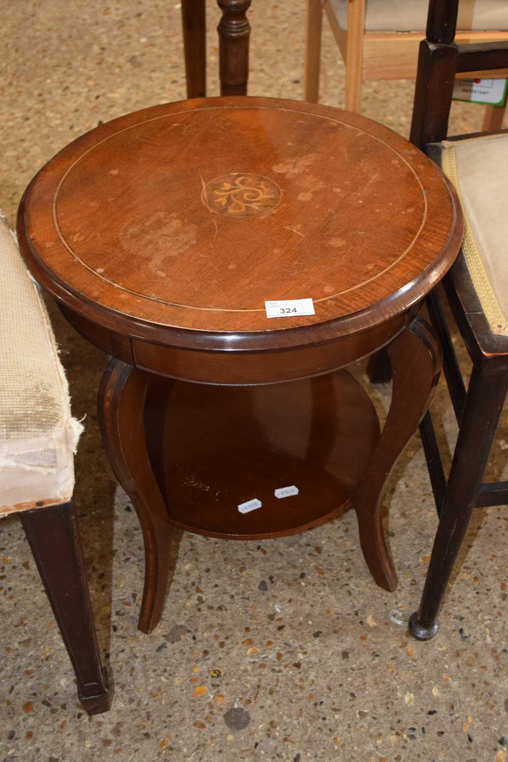 An Edwardian circular two tier occasional table