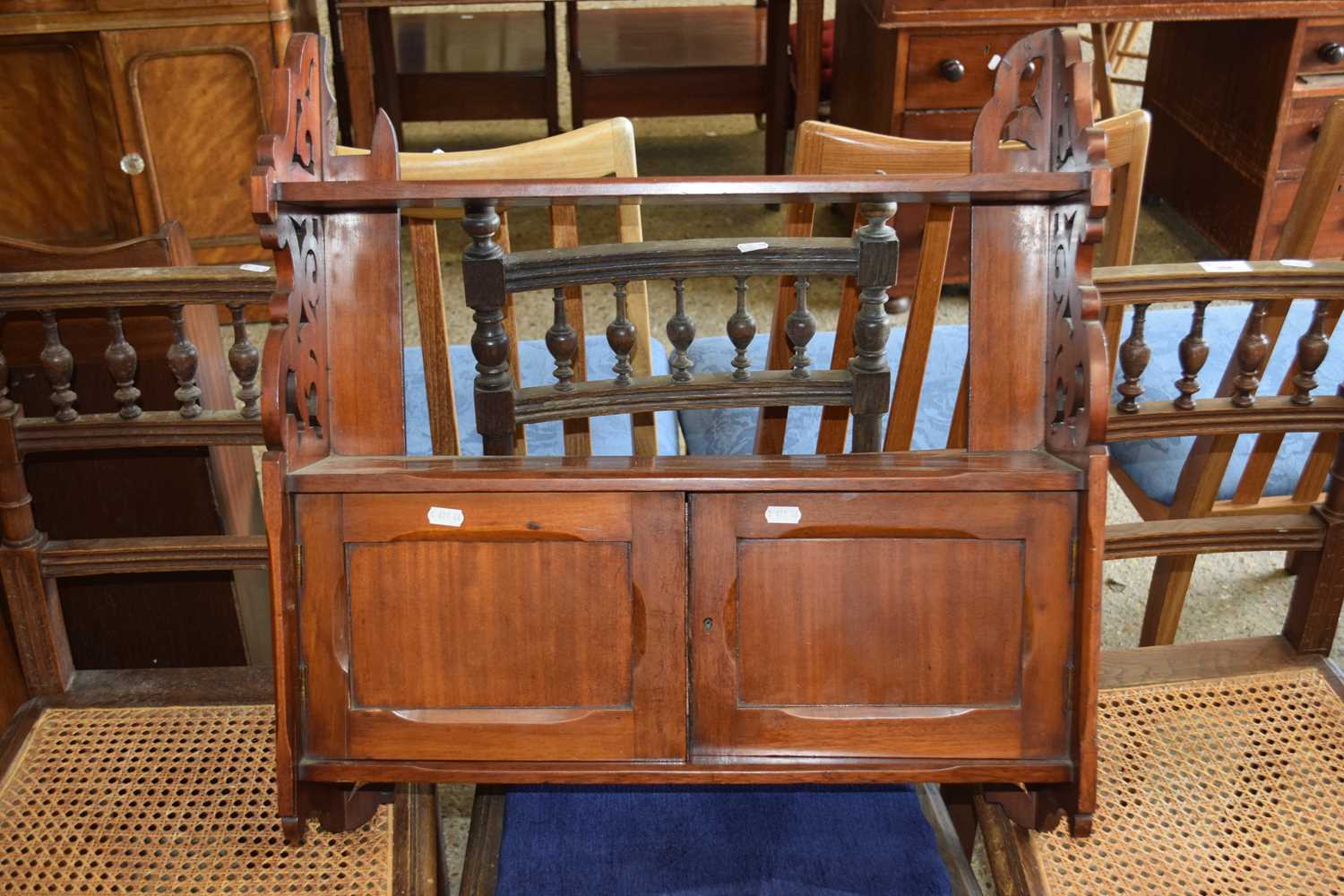 Late 19th Century mahogany combination wall shelf and cupboard with fretwork ends