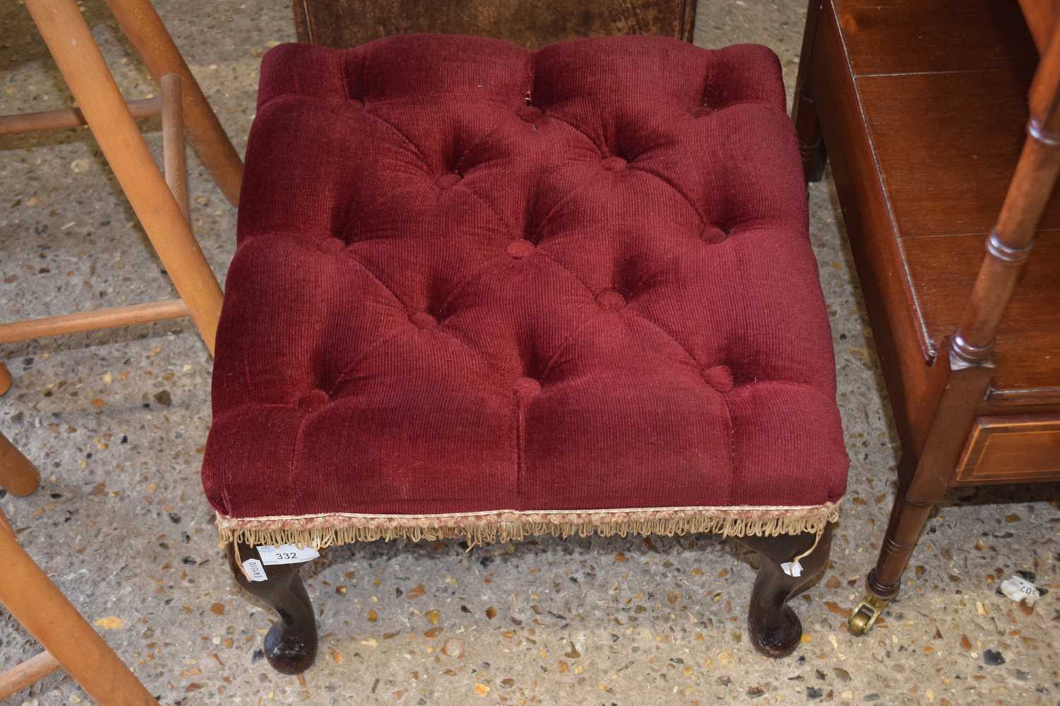 A button upholstered footstool