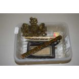 A box containing small brass plaque, various propelling pencils and other items