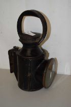 A vintage railway lamp marked LMS
