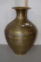 A modern embossed brass vase
