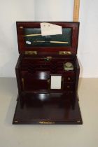 A small Victorian mahogany and inlaid stationery cabinet with drop down front and fitted interior