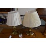 Two modern brass based table lamps