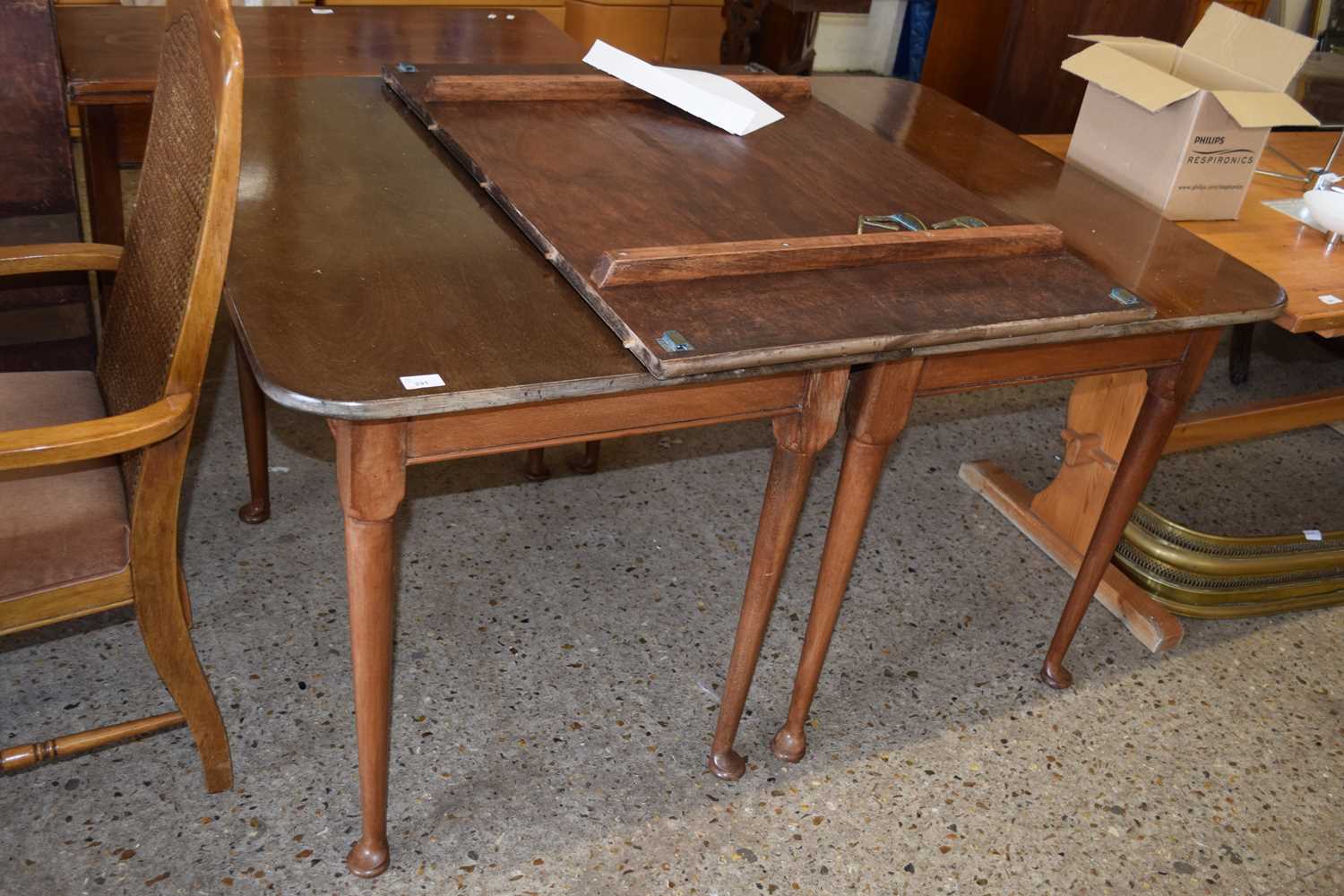 A Georgian mahogany two section extending dining table with tapering legs and pad feet together with